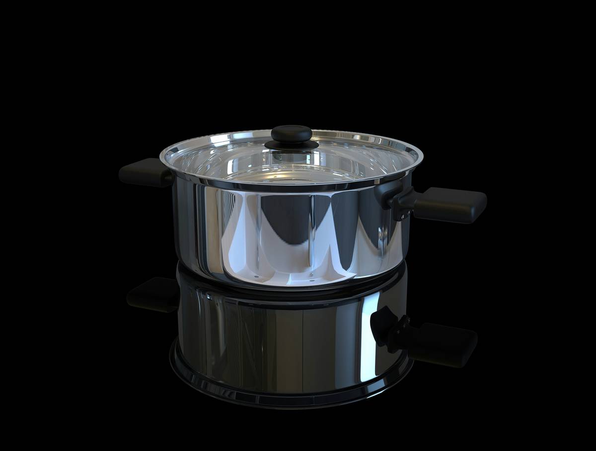 A clean stainless steel electric pressure cooker on a kitchen counter with measuring cups nearby, illustrating a beginners guide to pressure cooking setup